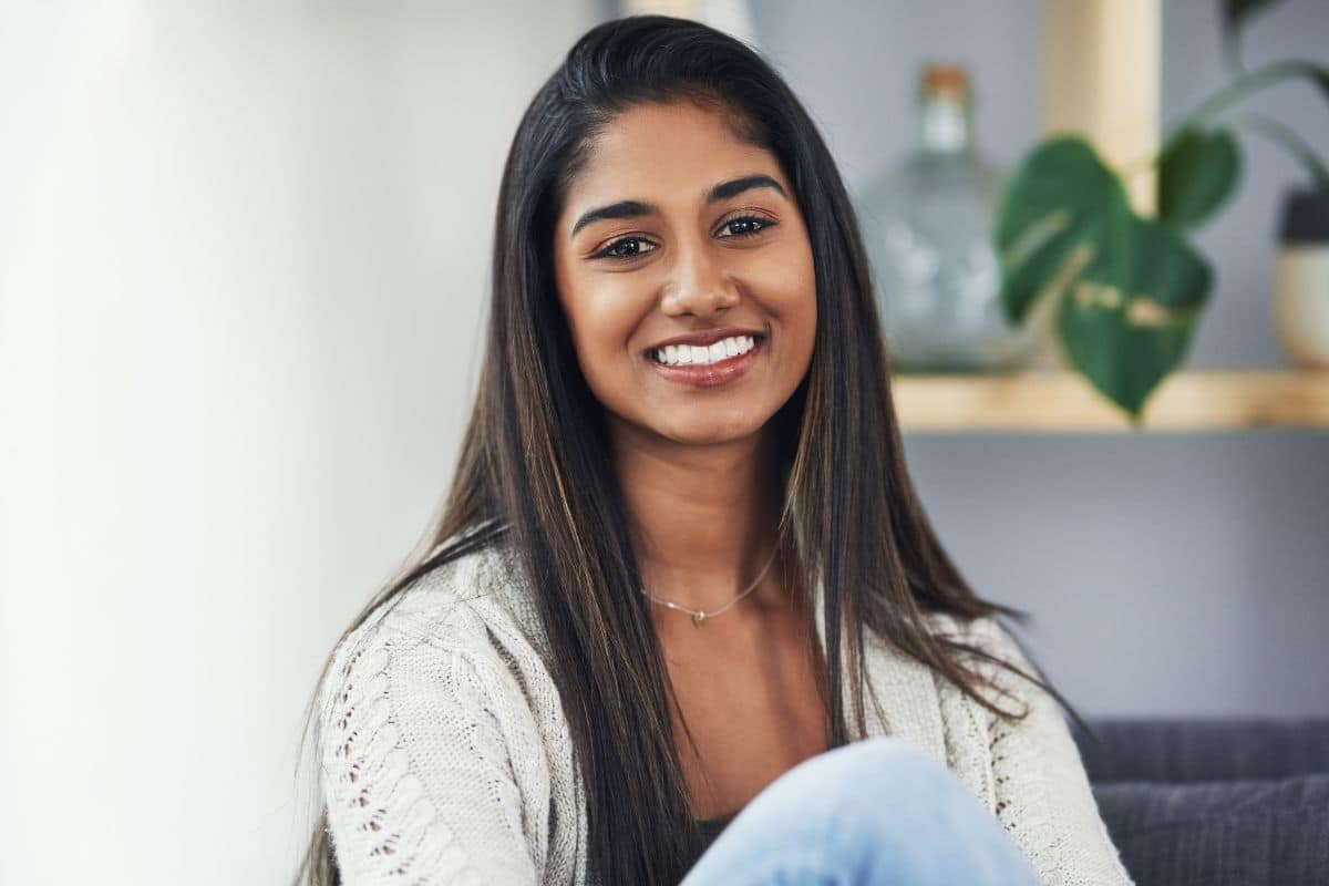 Attractive young woman relaxing on the couch at home