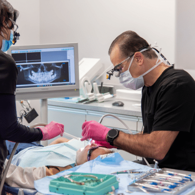 Dr. Joseph khalil working on a patient, representing number one dental practice